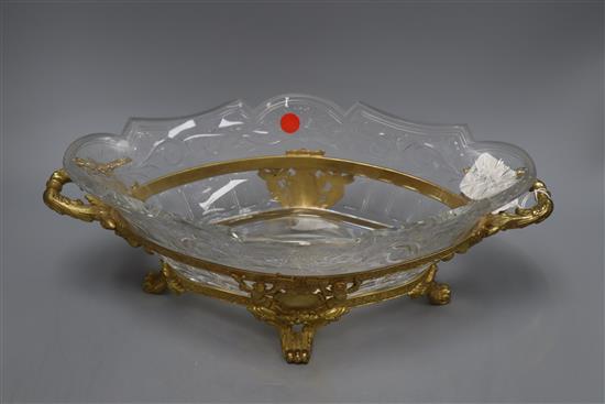 A cut glass bowl on ormolu stand, overall length 42cm